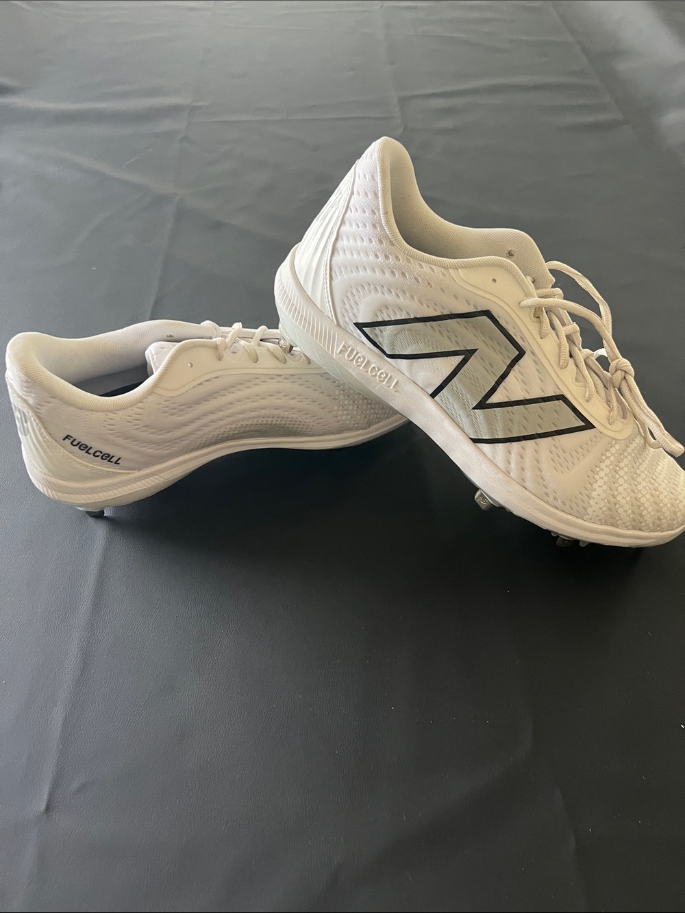 New Balance White Baseball Cleats with Black Logo